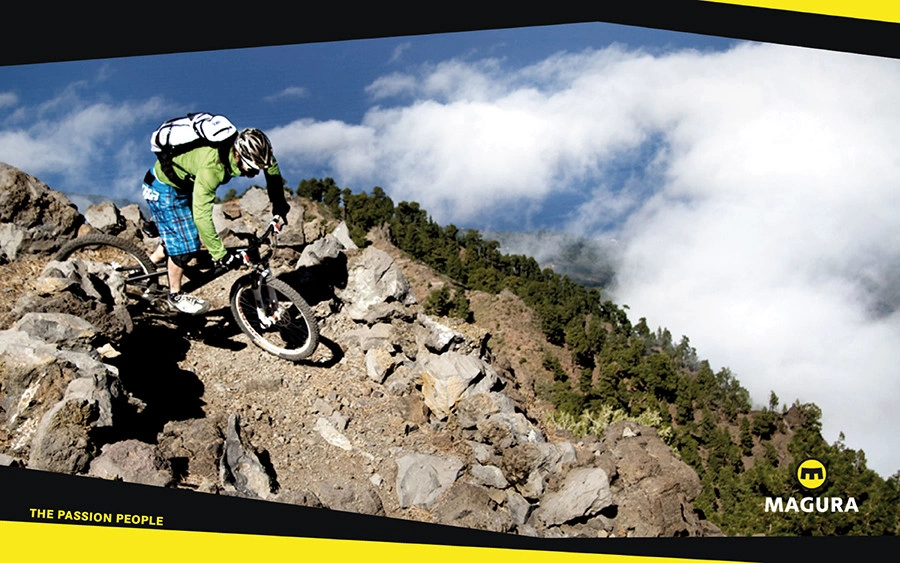 Magura Kampagnenlayout mit Mountainbiker auf einem steilen, felsigen Trail